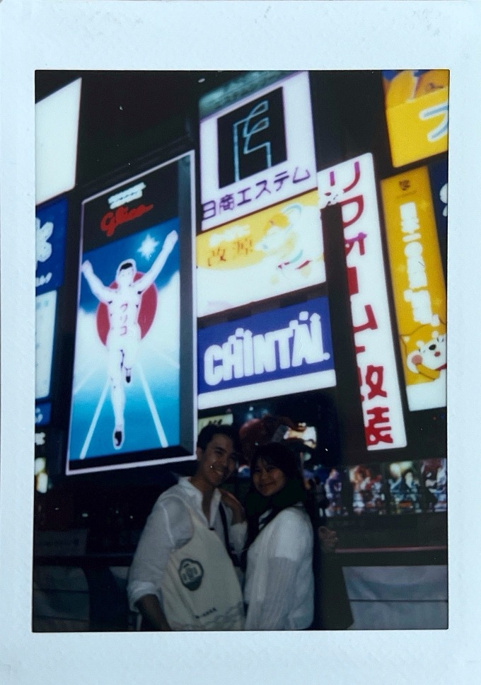Jon and Mika under the glico man sign